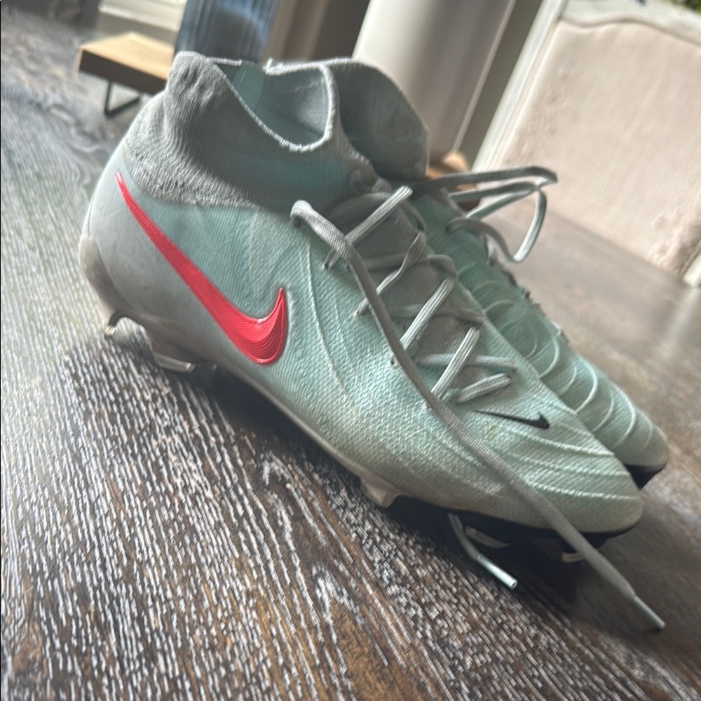 Nike Light Blue Soccer Cleats with Red Swoosh